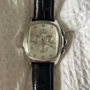 I am selling an Invicta 6401 Lupah Chronograph Watch with a black leather band.